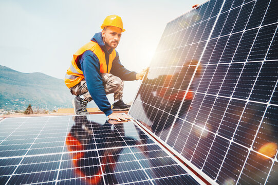 Engineer fitting solar panel system